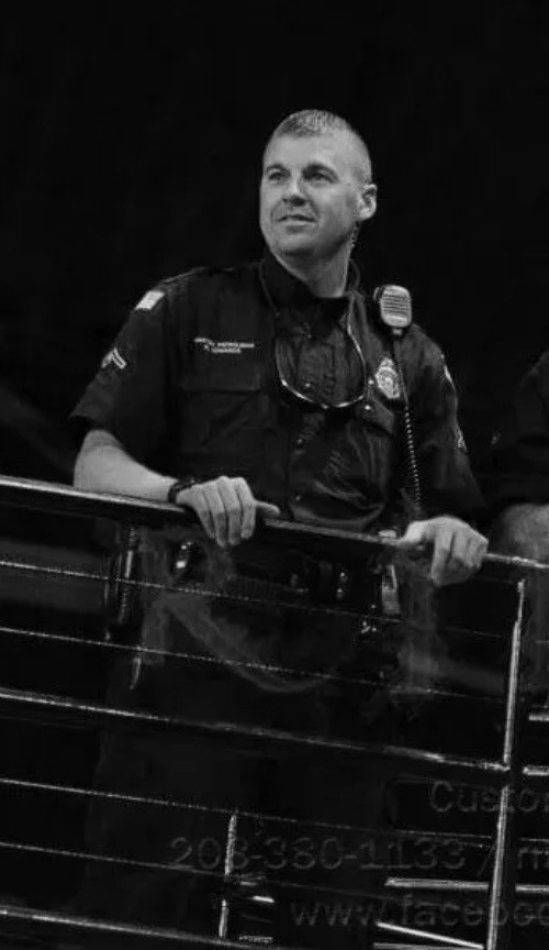 Black-and-white law enforcement image of Nick Edwards on duty