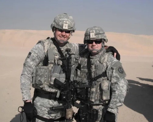 Two soldiers in desert camouflage during deployment