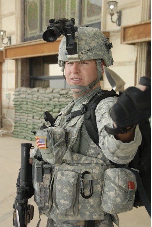 Nick Edwards in military gear during deployment
