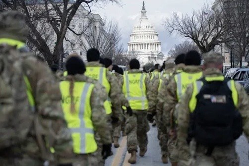 National Guard personnel walking near the U.S. Capitol